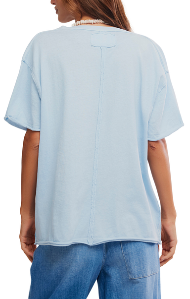 Light blue shirt worn by a person on a white background