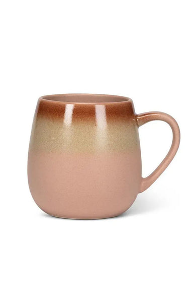 A ceramic mug with a smooth gradient glaze transitioning from a warm brown at the top to a muted dusty pink at the bottom, set against a plain white background.