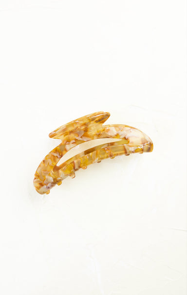 Yellow hair clip on a white background