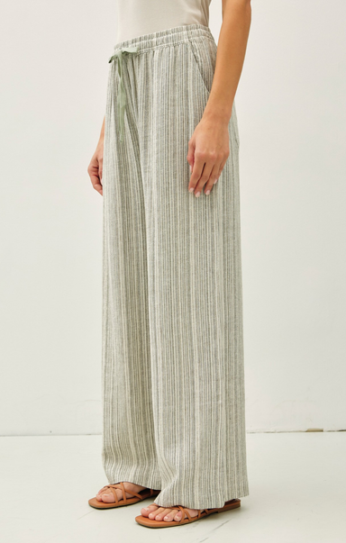 Striped wide-leg pants worn by a person on a white background