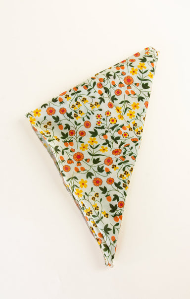 Floral-patterned triangle-shaped product on a white background