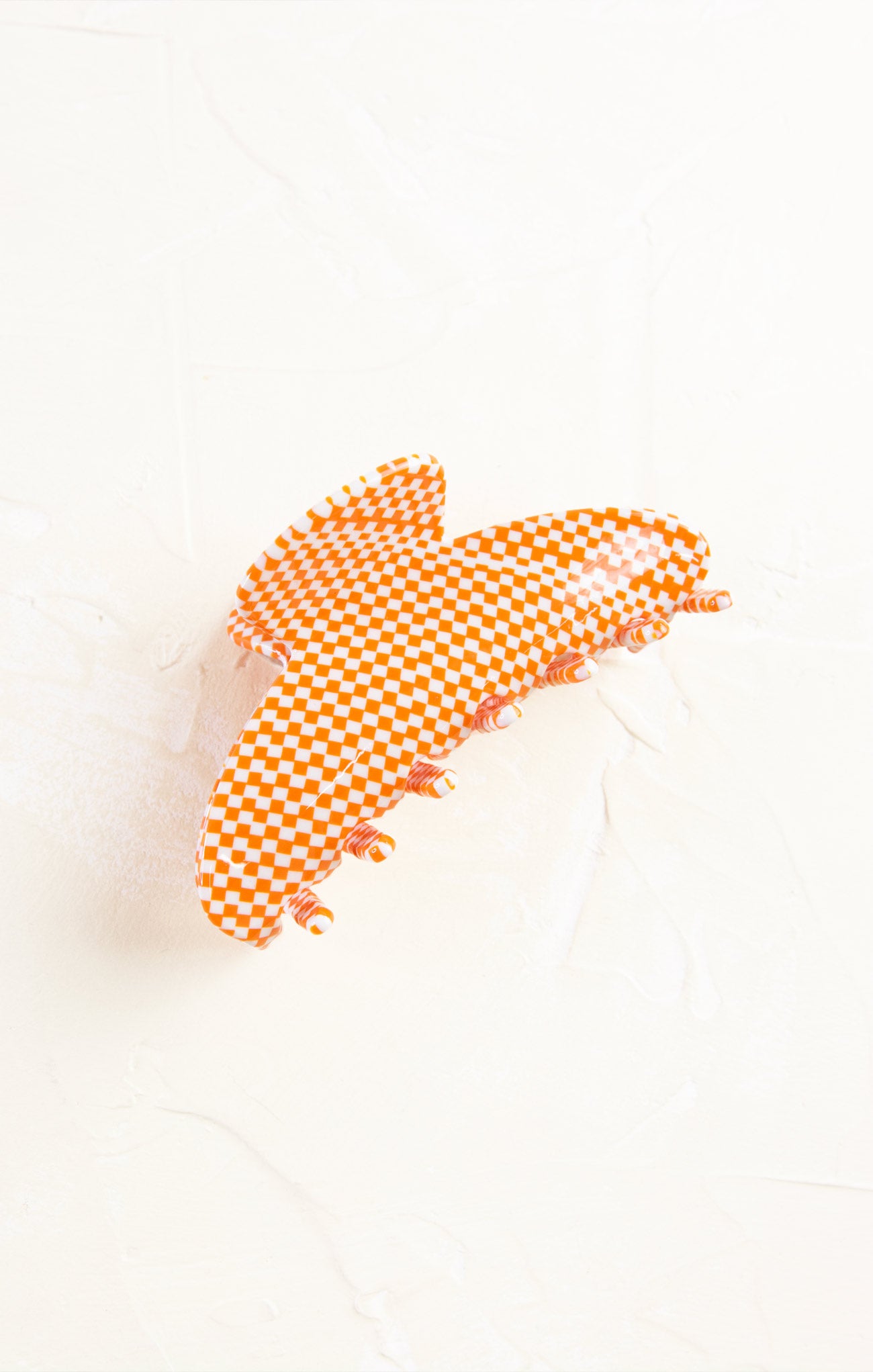 Orange checkered pattern on a white background