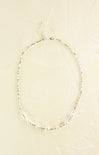 Pearl necklace on a beige background