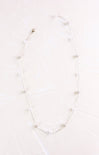 Necklace with small pearls on a white background