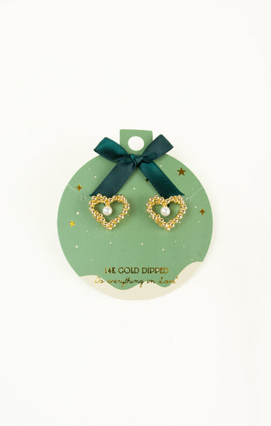 Gold heart-shaped earrings on a green card with a bow