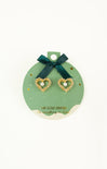 Gold heart-shaped earrings on a green card with a bow