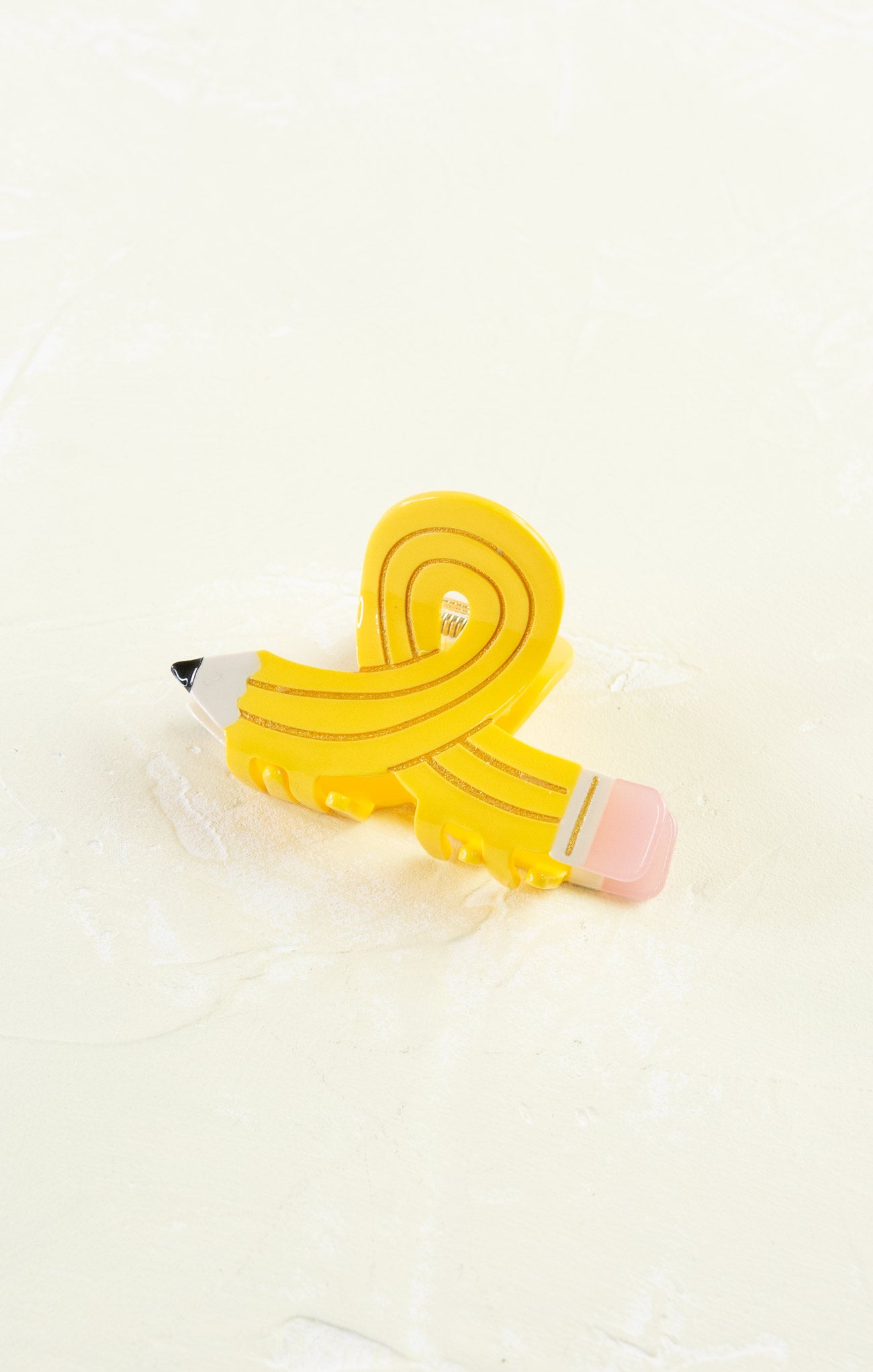 Yellow pencil-shaped eraser on a white background