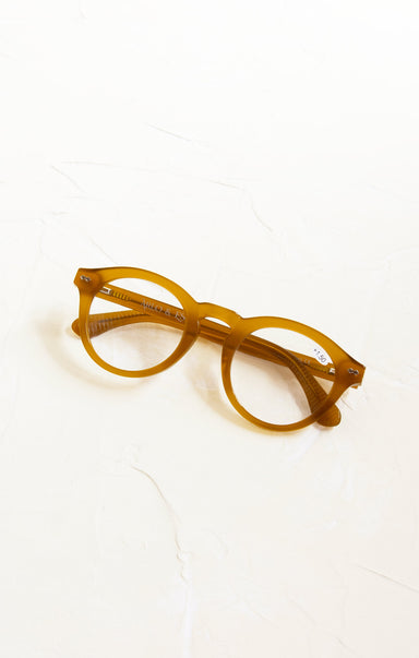 Yellow eyeglasses on a white background