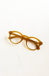 Yellow eyeglasses on a white background
