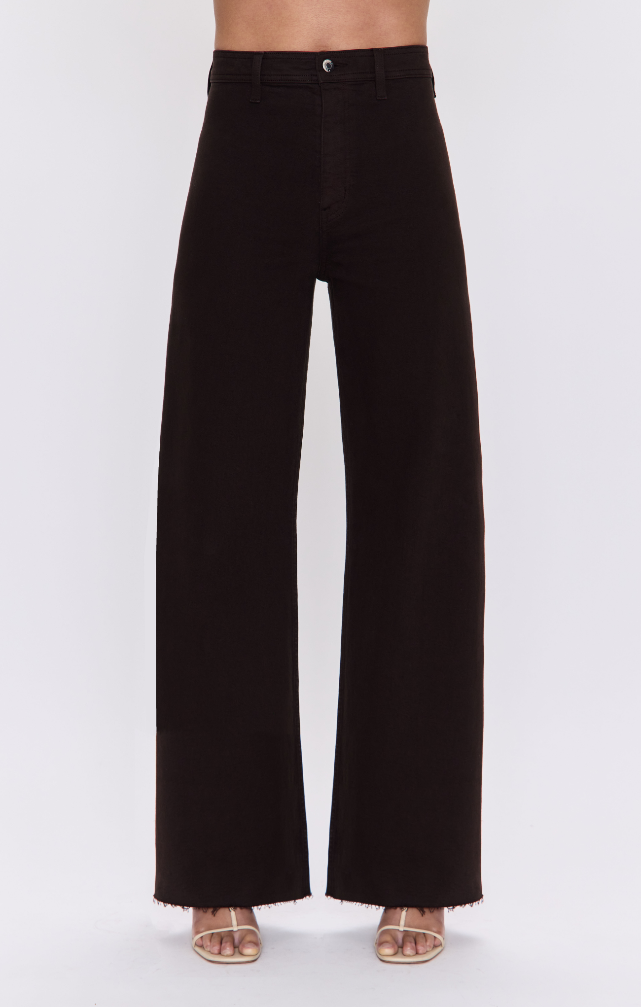 Black wide-leg cropped pants with a frayed hem, shown on a model from the waist down wearing beige sandals against a light gray background.