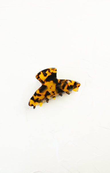 Tortoiseshell hair clip on a white background
