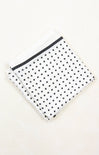 Polka dot pouch with a black zipper on a white background