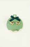 Heart-shaped gold earrings on a green card with a bow