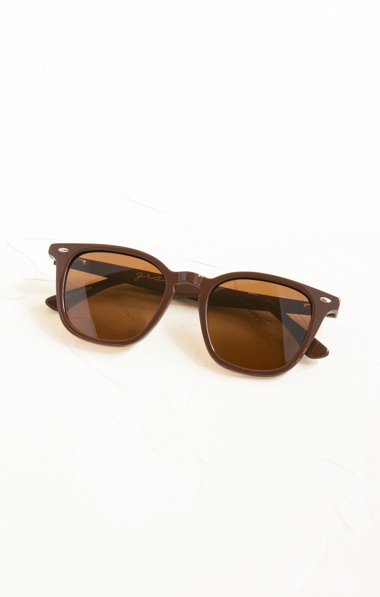 Brown sunglasses on a white background
