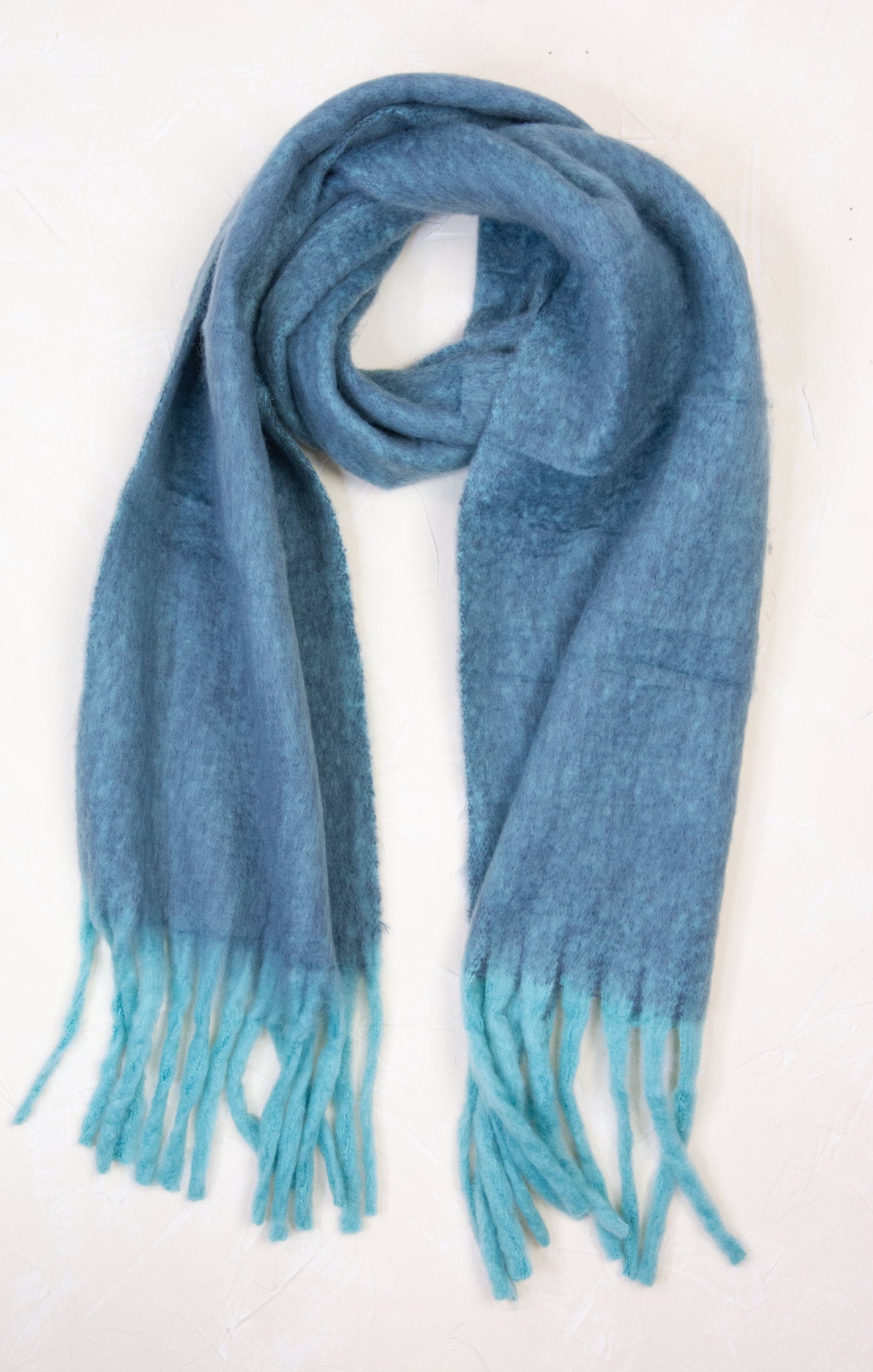 Blue scarf with turquoise tips on a white background