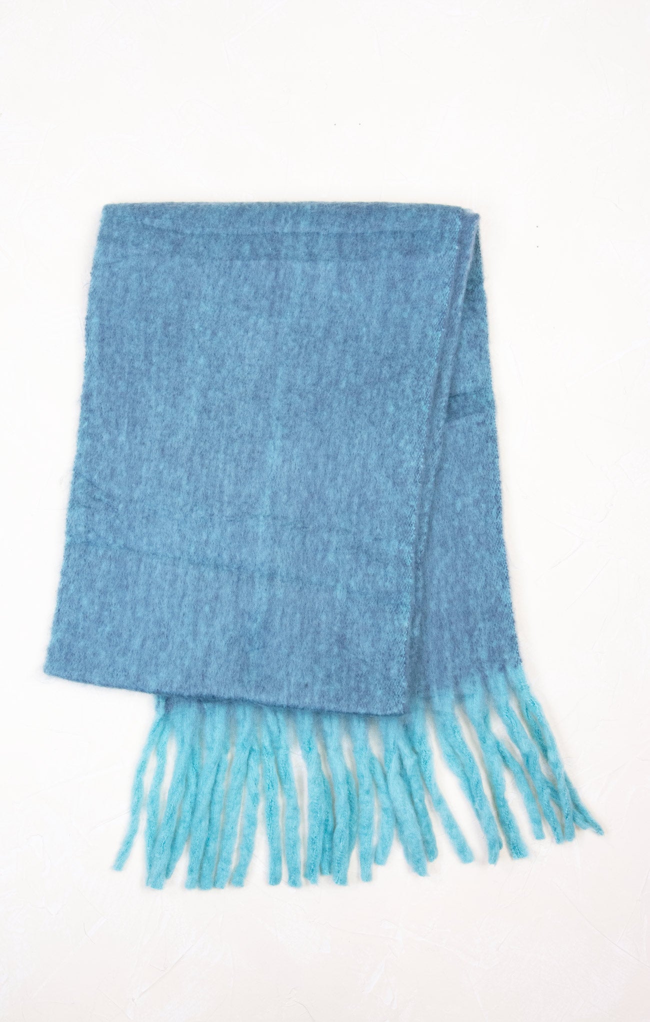 Blue scarf with fringes on a white background