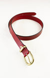 Red belt with a gold buckle on a white background