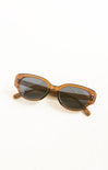 Brown sunglasses with dark lenses on a white background