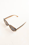 Sunglasses with brown frame and dark lenses on a white background