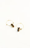 Gold hoop earrings with black stone accents on a white background