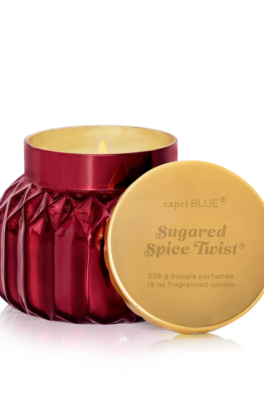 Capri Blue Sugared Spice Twist candle with red container and gold lid on a white background
