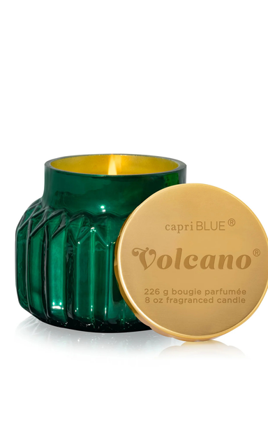 Green candle with gold lid labeled 'capri BLUE Volcano' on a white background