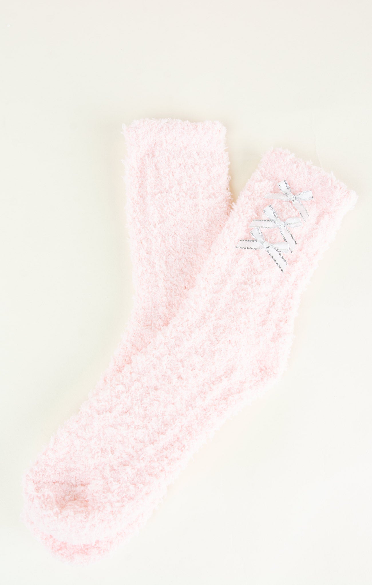 Pink textured fabric with a subtle pattern on a light background