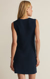 Navy sleeveless dress worn by a person on a beige background
