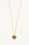 Gold heart-shaped necklace with colorful stones on a white background