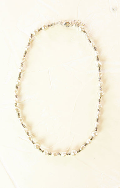 Necklace with small beads on a white background