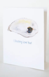 A white greeting card featuring a watercolor illustration of an oyster shell with the text 'I Shucking Love You!' printed below in blue.