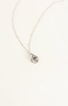 Teardrop-shaped pendant necklace on a white background