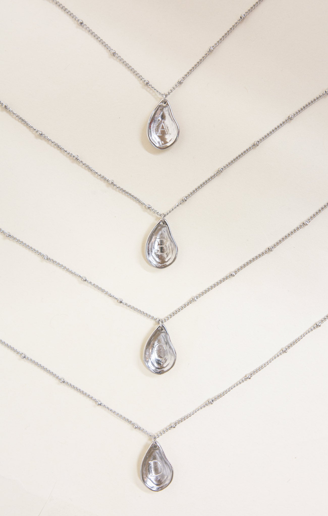 Necklace with teardrop-shaped pendants on a white background