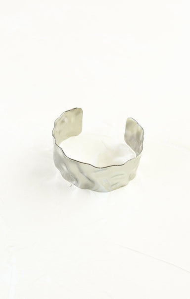 Silver cuff bracelet on a white background