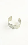 Silver cuff bracelet on a white background