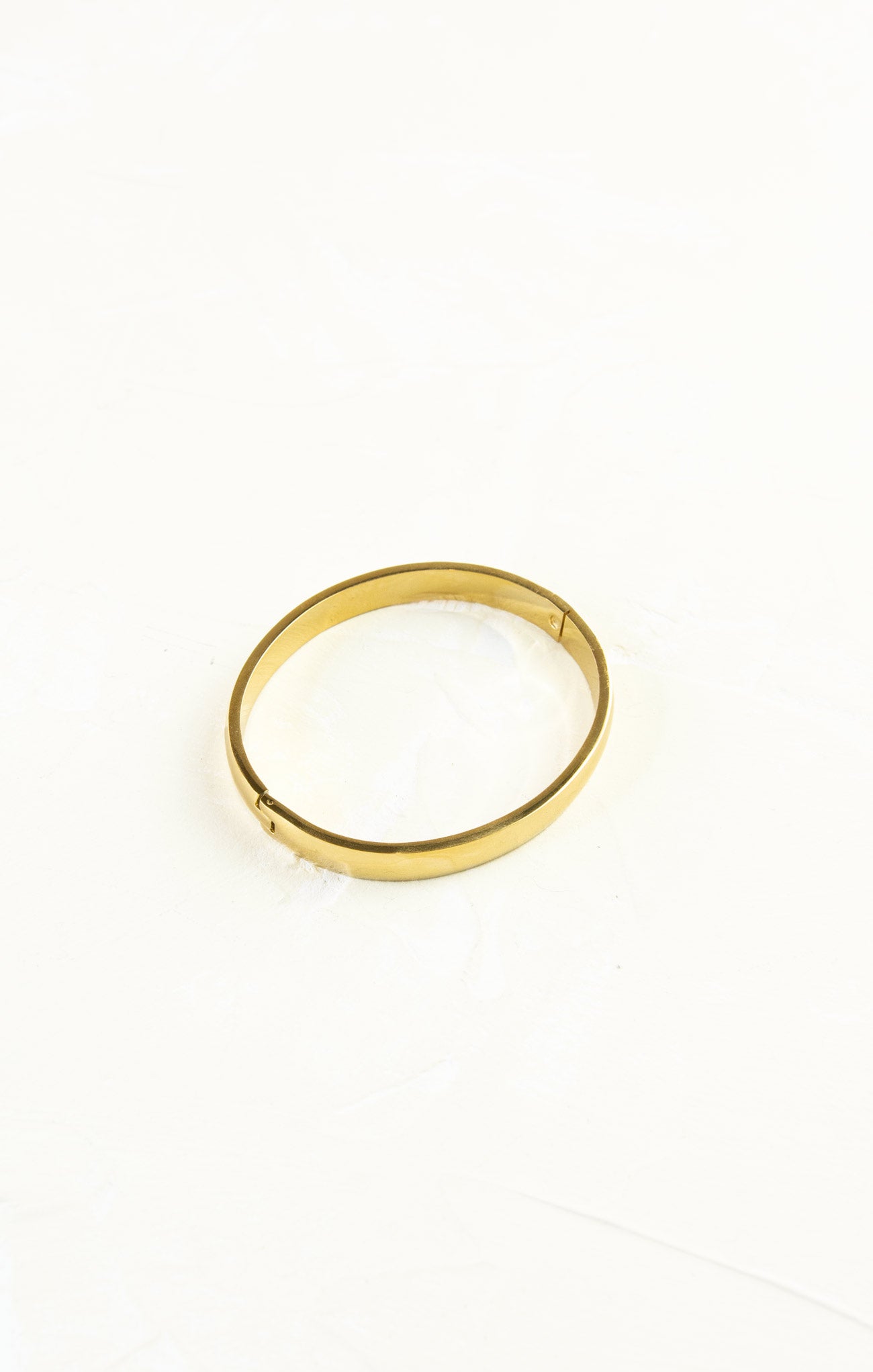 Gold ring on a white background