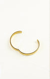 Gold bracelet on a white background