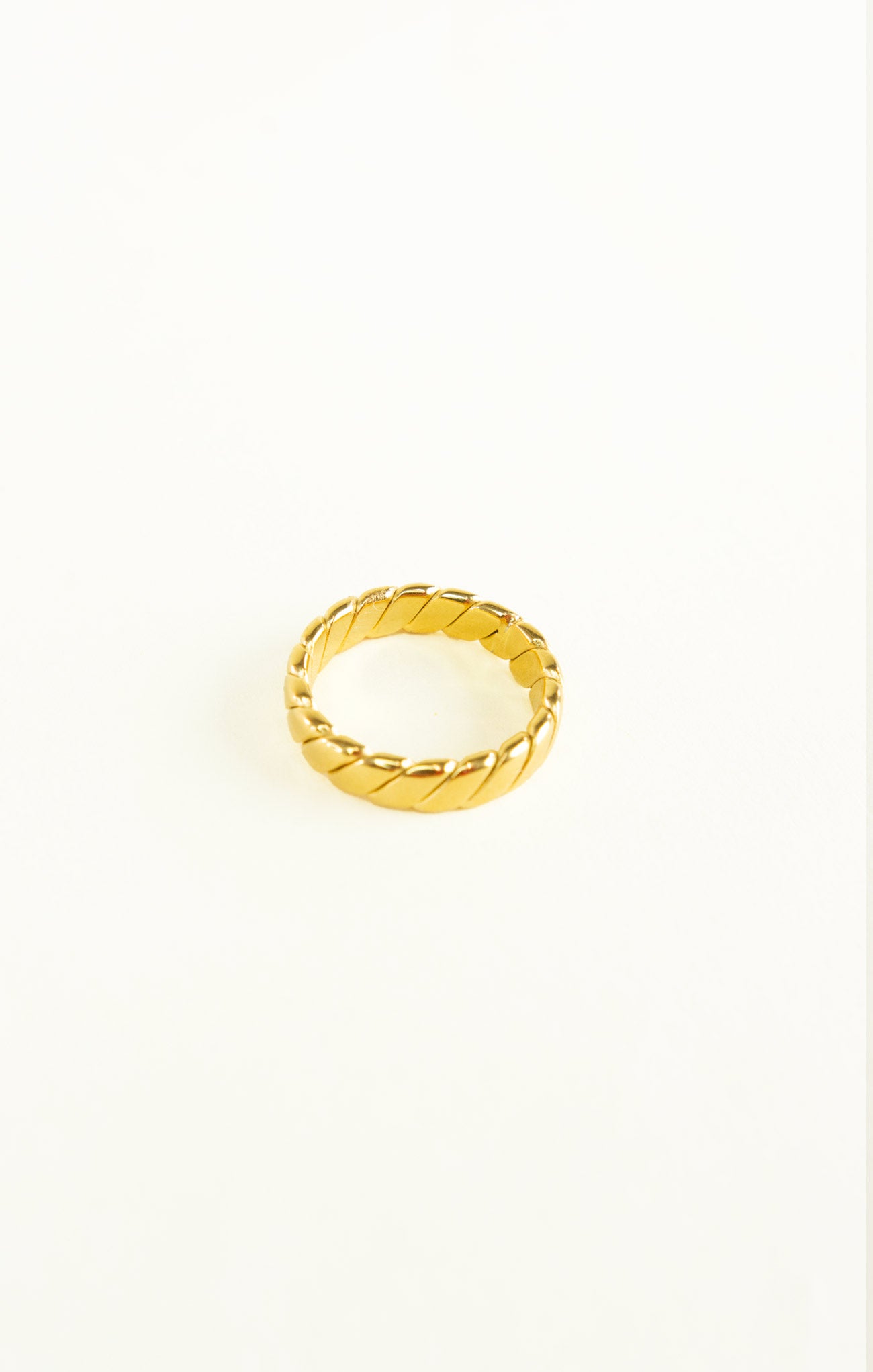Gold ring on a white background