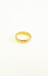 Gold ring with a textured design on a white background