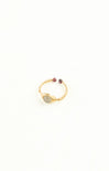 Gold bracelet with gemstones on a white background