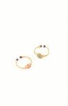 Pair of gold earrings with gemstones on a white background