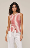 Woman wearing a red and white striped sleeveless top with a beige background