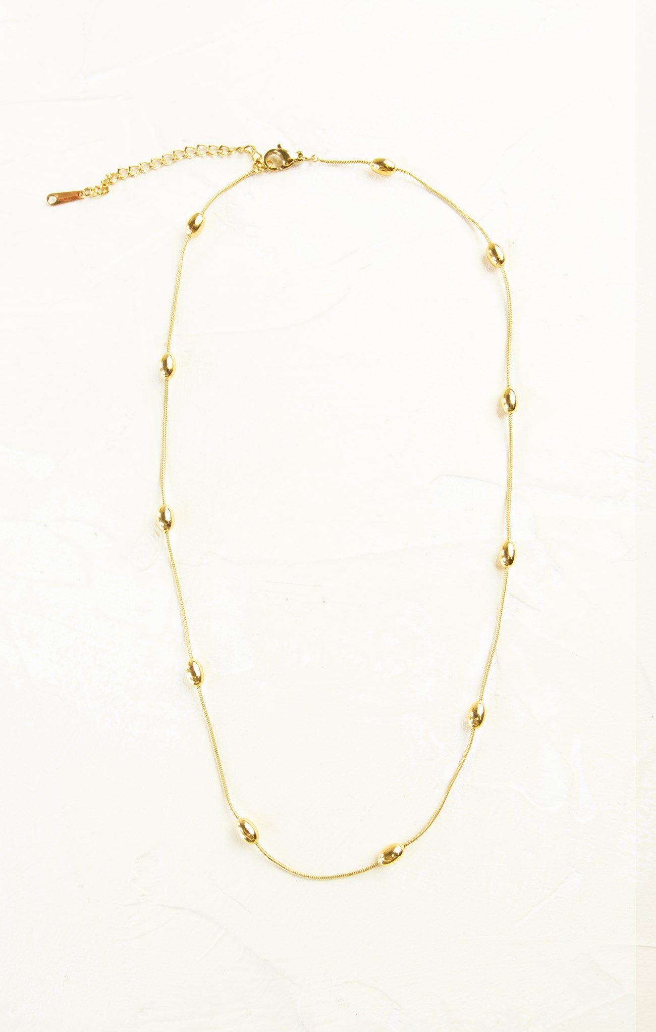 Gold necklace on a white background