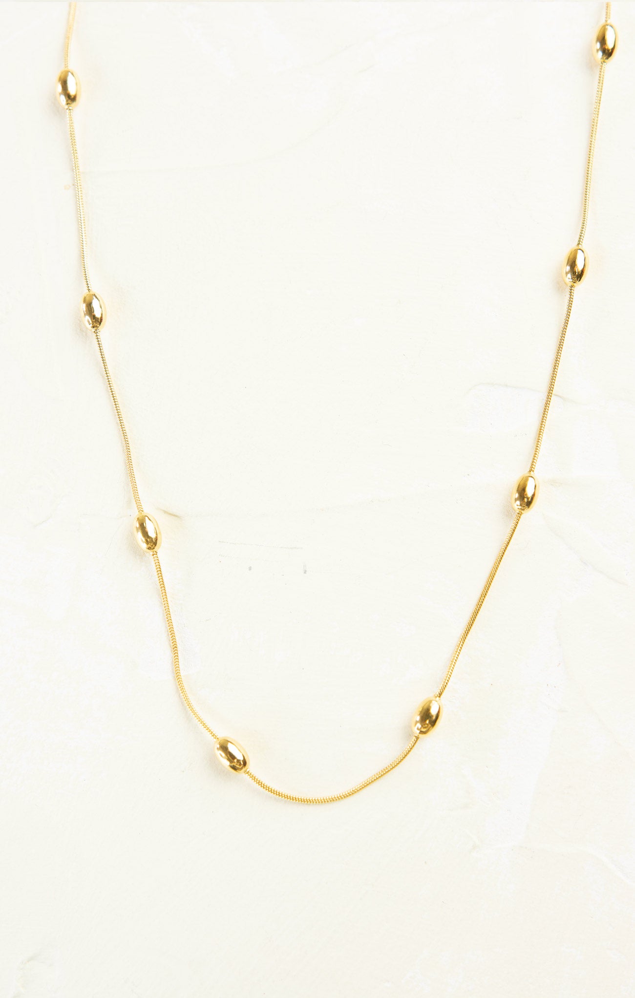 Gold necklace on a white background
