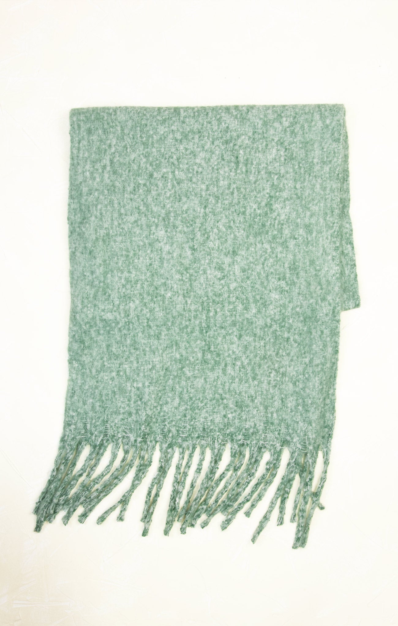 Green scarf with fringes on a white background