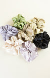 Set of colorful scrunchies on a light background