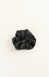 Black scrunchie on a white background