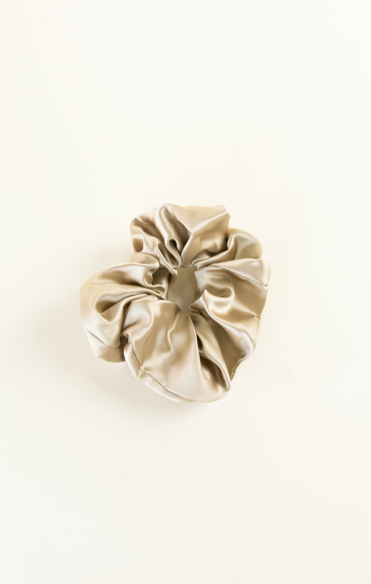 Beige scrunchie on a white background
