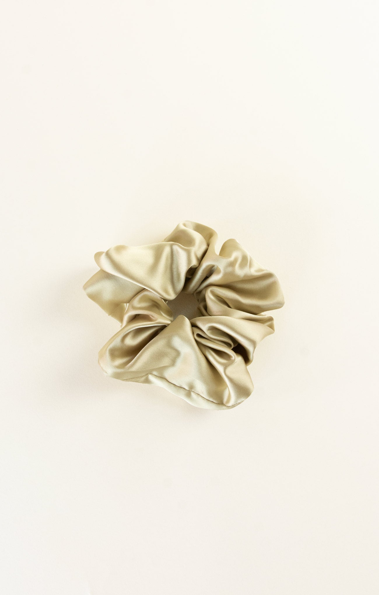 Beige scrunchie on a white background