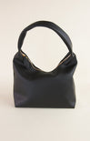 Black handbag with gold zipper on a white background